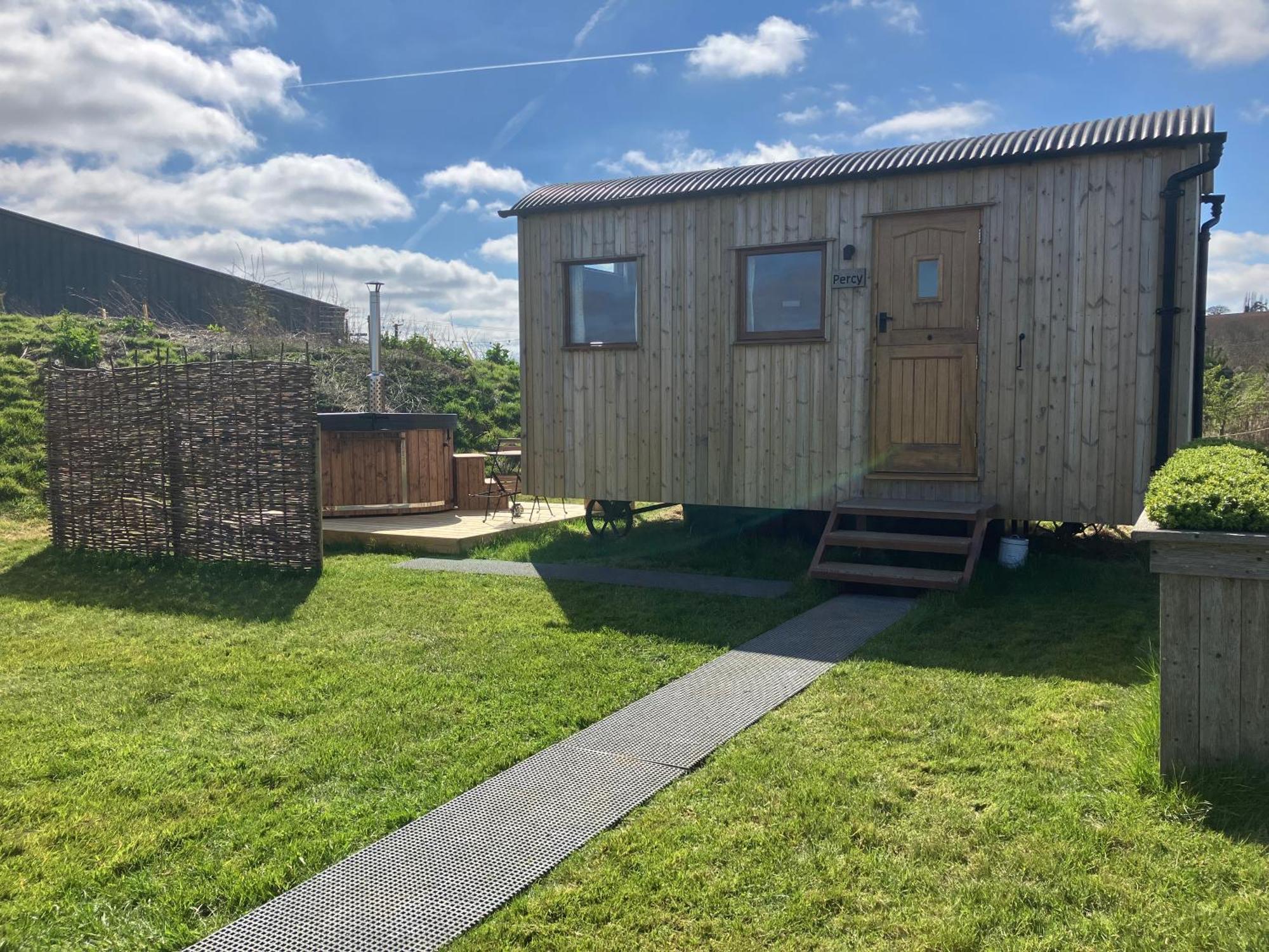 Shepherd's Huts In Barley Meadow At Spring Hill Farm